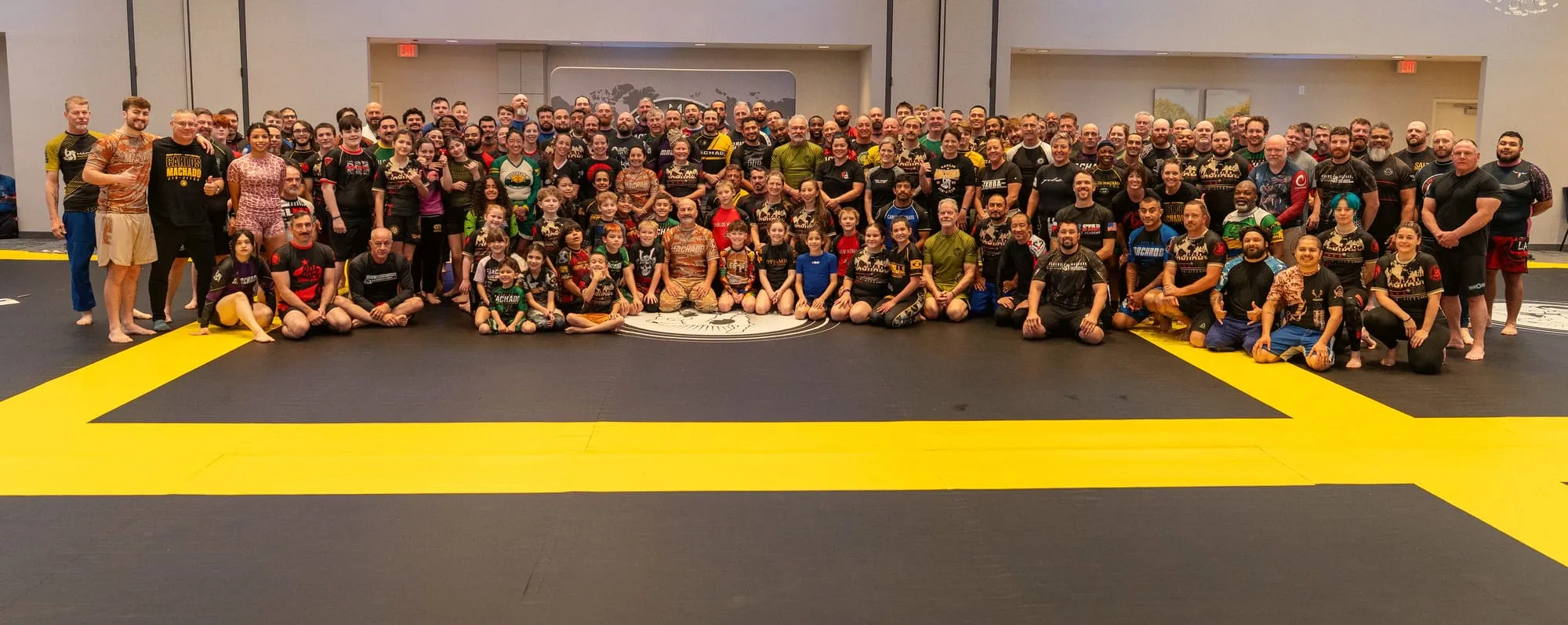 The whole Summit group assembled across the mat, several hundred students and instructors